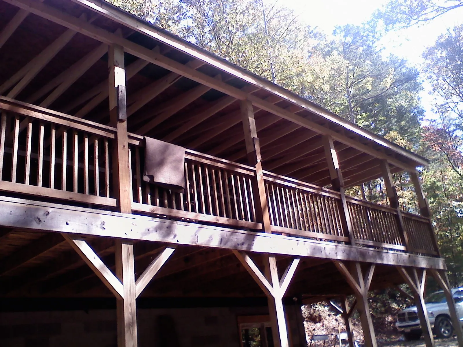 Timber framing under a new elevated porch and deck — Roof Leak Repair in Bigfork by Roofing Brothers